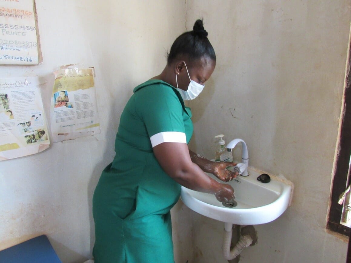 A nurse using a newly installed sinks at the ANC
