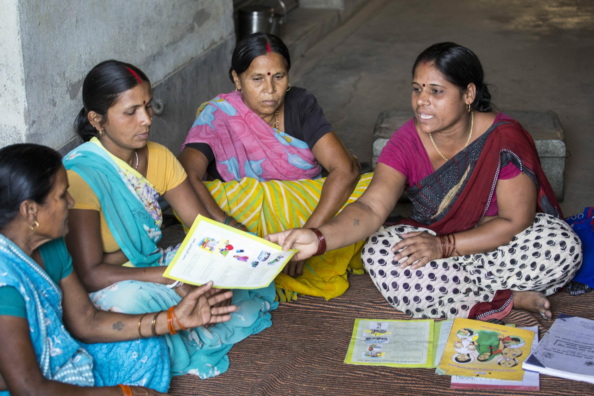 Indian women participating in a group meeting
