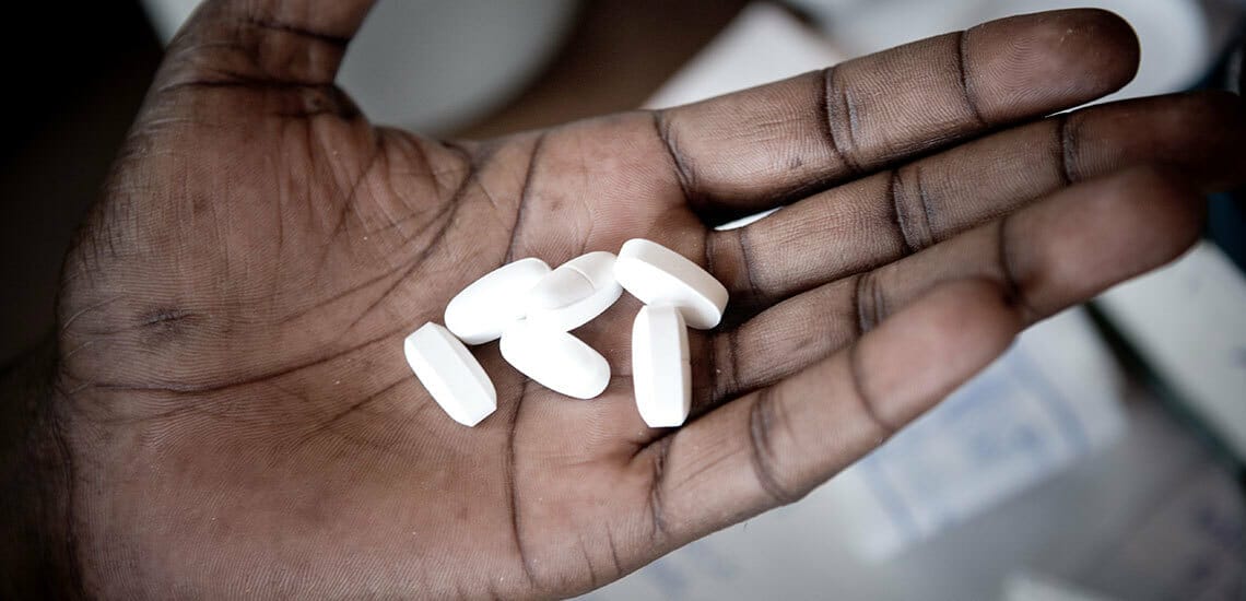Hand holding HIV/AIDS medication
