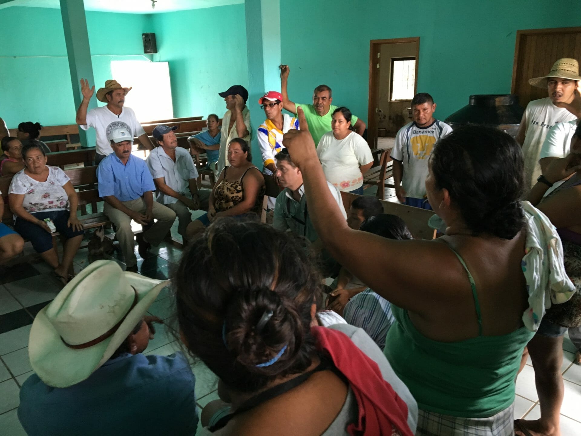 Group of people in room at a meeting