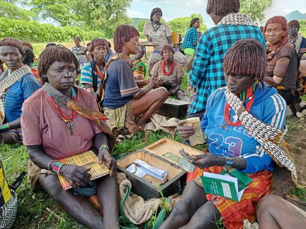 women counting money in a women's group in Ethiopia